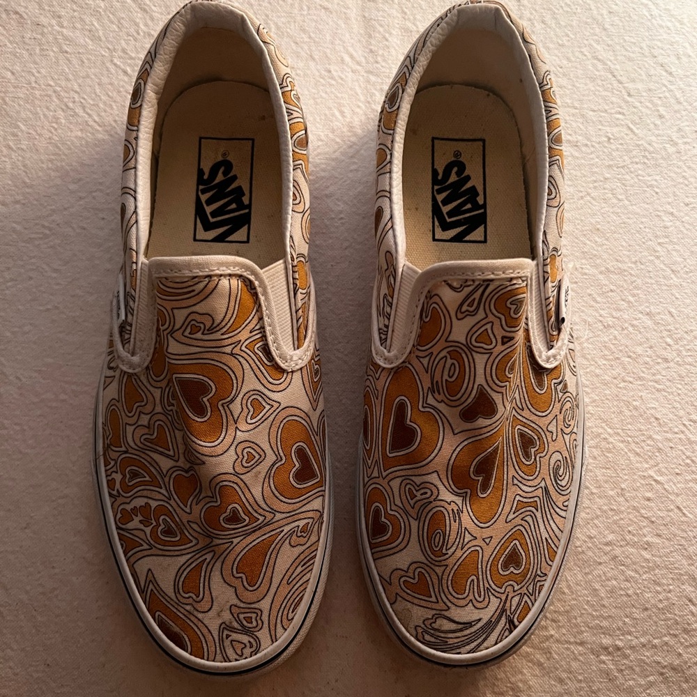 vans slip ons with hearts.
never worn.